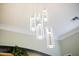 Contemporary light fixture with glass cylinder pendants at 12943 W Mclellan Rd, Glendale, AZ 85307
