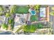 Stunning aerial view of a home with a pool, basketball court, and lush landscaping at 13110 W Denton St, Litchfield Park, AZ 85340