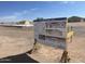 Sign showing Luxury Spec Home - Lot A with floorplans and renderings of the exterior at 10784 E Angus Ln, Coolidge, AZ 85128