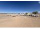 Poured foundation with lumber stacked in a desert construction site with utilities at 10784 E Angus Ln, Coolidge, AZ 85128