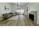 Spacious living room features a fireplace, hardwood floors, and a sliding glass door to backyard at 5984 W Geronimo Ct, Chandler, AZ 85226