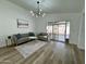 Inviting living room with modern decor, hardwood floors, and a sliding door to the backyard at 5984 W Geronimo Ct, Chandler, AZ 85226