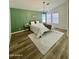 Main bedroom features a wood accent wall, modern decor, and wood-look floors at 5984 W Geronimo Ct, Chandler, AZ 85226