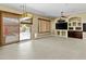 Gathering room with built-in entertainment center and sliding glass doors leading to backyard at 1553 E Zion Way, Chandler, AZ 85249