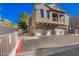 Attractive townhome with three garage spaces and a small balcony on a sunny day at 2402 E 5Th St # 1481, Tempe, AZ 85288