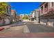 A residential neighborhood with houses that have garages and a well-maintained parking area at 2402 E 5Th St # 1481, Tempe, AZ 85288