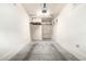 An empty garage with storage racks and a concrete floor at 2402 E 5Th St # 1481, Tempe, AZ 85288