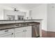 Bright kitchen featuring white cabinets, stainless steel appliances, open layout and dining area at 2402 E 5Th St # 1481, Tempe, AZ 85288