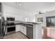 Bright kitchen featuring white cabinets, stainless steel appliances, and an open layout at 2402 E 5Th St # 1481, Tempe, AZ 85288