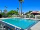 Sparkling community pool with lounge chairs and a gated area at 7217 E Valley View Rd, Scottsdale, AZ 85250
