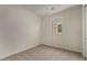 Bedroom featuring neutral carpet and a single window with natural light at 2878 N Evergreen St, Buckeye, AZ 85396