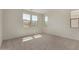 Spacious bedroom with plush carpet, several windows, and abundant natural light at 2878 N Evergreen St, Buckeye, AZ 85396
