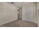 Bedroom featuring neutral carpet, double door closet, and natural light at 2878 N Evergreen St, Buckeye, AZ 85396