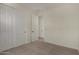 Bedroom featuring neutral carpet and double door closet at 2878 N Evergreen St, Buckeye, AZ 85396