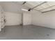 Spacious garage with epoxy flooring and ample room for parking and storage at 2878 N Evergreen St, Buckeye, AZ 85396