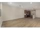 Open concept living area with kitchen featuring wood cabinets, stainless appliances, and island at 2878 N Evergreen St, Buckeye, AZ 85396