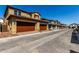 Street view of community featuring houses with two-car garages and tile roofs at 2878 N Evergreen St, Buckeye, AZ 85396