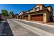 Street view of community featuring houses with two-car garages and tile roofs at 2878 N Evergreen St, Buckeye, AZ 85396