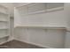 Spacious walk-in closet featuring custom shelving and ample storage space at 2878 N Evergreen St, Buckeye, AZ 85396