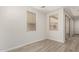 Bright bedroom with wood-look flooring and natural light at 2888 N Evergreen St, Buckeye, AZ 85396