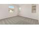 Neutral bedroom with three windows providing lots of natural light at 2888 N Evergreen St, Buckeye, AZ 85396