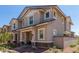 Charming two-story home featuring a covered porch and landscaped front yard, creating a welcoming curb appeal at 2888 N Evergreen St, Buckeye, AZ 85396