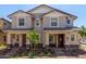 Inviting townhouse-style homes with well-maintained landscaping and charming front porches, perfect for relaxing at 2888 N Evergreen St, Buckeye, AZ 85396