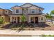 Inviting townhome featuring manicured landscaping, covered porches, and a welcoming atmosphere at 2888 N Evergreen St, Buckeye, AZ 85396