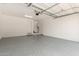 Spacious garage features an epoxy floor, with a water heater and access door at 2888 N Evergreen St, Buckeye, AZ 85396
