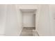 Hallway with light gray wood flooring, white walls and trim, and an alcove at the end at 2888 N Evergreen St, Buckeye, AZ 85396
