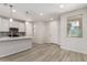 Bright kitchen with stainless steel appliances, a center island, and wood-look flooring at 2888 N Evergreen St, Buckeye, AZ 85396