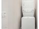 A stackable washer and dryer saves space in this home's convenient laundry closet at 2888 N Evergreen St, Buckeye, AZ 85396