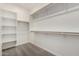 Spacious walk-in closet with white shelving and carpet at 2888 N Evergreen St, Buckeye, AZ 85396