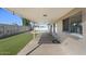 Enjoy the covered back patio, view of the pool, and easy access to the house at 2409 E Hampton Ave, Mesa, AZ 85204