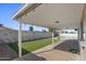 Enjoy the covered back patio, pool, and artificial grass for easy yard maintenance at 2409 E Hampton Ave, Mesa, AZ 85204
