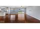 Open living area with hardwood floors, recessed lighting, and a sliding glass door leading to the backyard at 2409 E Hampton Ave, Mesa, AZ 85204