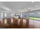 Open-concept living space with hardwood floors, modern lighting, and a view of the backyard at 2409 E Hampton Ave, Mesa, AZ 85204