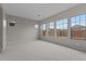 Bright bedroom with carpet flooring and large windows providing natural light at 12315 W Parkway Ln, Avondale, AZ 85323