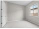 This bedroom features carpeted floors, one window, and neutral walls at 12315 W Parkway Ln, Avondale, AZ 85323