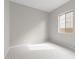 This bedroom features carpeted floors and one window at 12315 W Parkway Ln, Avondale, AZ 85323