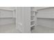 Spacious walk-in closet with multiple shelves at 12315 W Parkway Ln, Avondale, AZ 85323
