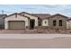 Beautiful single-story home with a brick-paved walkway and meticulously landscaped front yard at 12315 W Parkway Ln, Avondale, AZ 85323