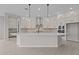 Bright kitchen featuring white cabinets, quartz counters, and stainless steel appliances at 12315 W Parkway Ln, Avondale, AZ 85323