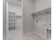 This laundry room has shelving and hookups at 12315 W Parkway Ln, Avondale, AZ 85323