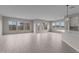 Bright living room with light wood flooring and large windows providing natural light at 12315 W Parkway Ln, Avondale, AZ 85323