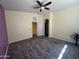 Large bedroom featuring neutral tones, carpet flooring, and ceiling fan at 4683 E Nightingale Ln, Gilbert, AZ 85298