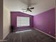 Bedroom with vaulted ceiling, carpet flooring, and a large window for natural light at 4683 E Nightingale Ln, Gilbert, AZ 85298