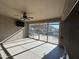 Sun-filled sunroom with a ceiling fan, large windows, and neutral tones at 4683 E Nightingale Ln, Gilbert, AZ 85298