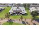 Stunning aerial view of a condo featuring a spacious patio, lush green lawn, and access to walking paths at 10224 E Michigan Ave, Sun Lakes, AZ 85248