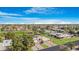 Aerial view of neighborhood homes with golf course in view at 10224 E Michigan Ave, Sun Lakes, AZ 85248